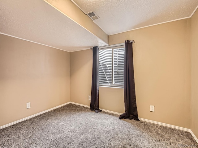 unfurnished room featuring a textured ceiling and carpet flooring