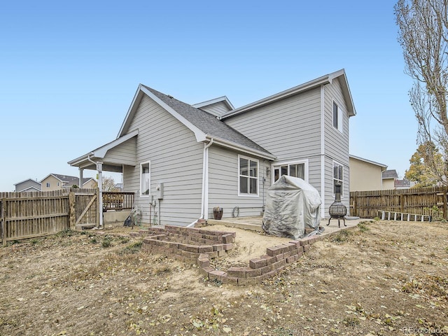 back of house with a patio area