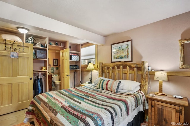 bedroom with light tile patterned floors