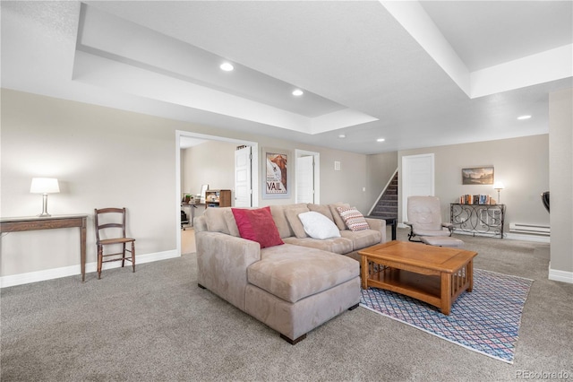 living room featuring baseboards, recessed lighting, a tray ceiling, a baseboard radiator, and carpet