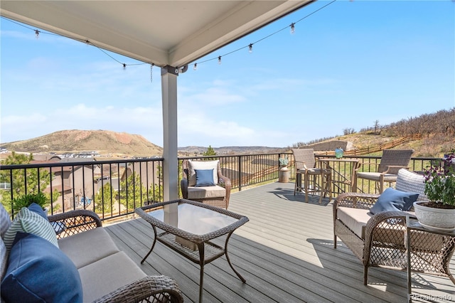 wooden terrace featuring a mountain view