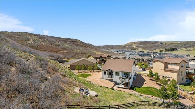 birds eye view of property with a mountain view and a residential view