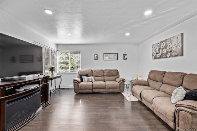 living room with recessed lighting, baseboards, and dark wood finished floors