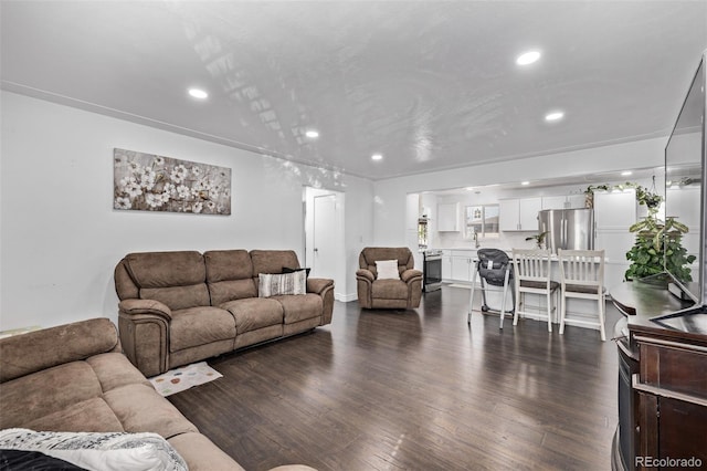 living room with recessed lighting and dark wood finished floors