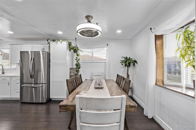 dining space with recessed lighting and dark wood finished floors