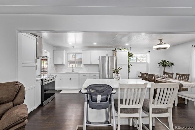 dining room featuring recessed lighting and dark wood finished floors
