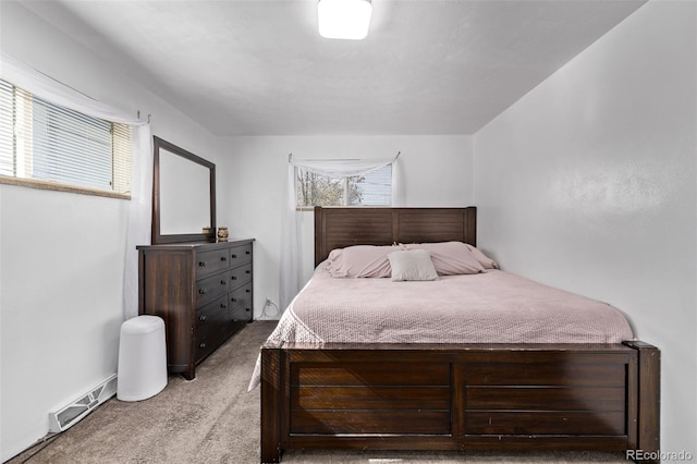 carpeted bedroom featuring visible vents