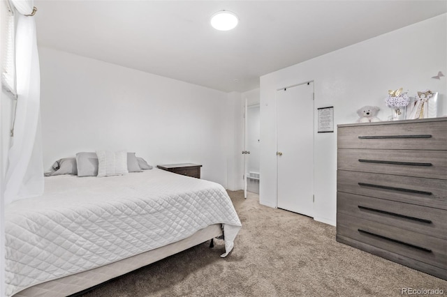 bedroom featuring light colored carpet