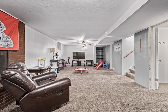 carpeted living room with stairs, a textured ceiling, and ceiling fan