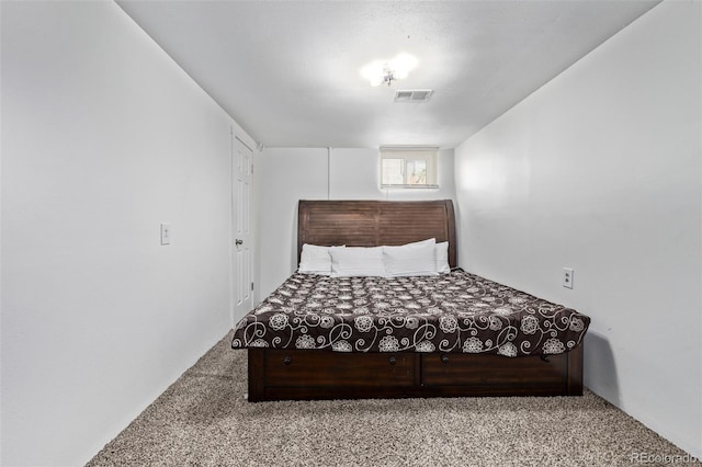 bedroom featuring visible vents and carpet