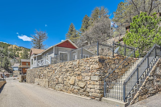 341 High St, Black Hawk, CO 80422 - view of home's exterior with stairway and fence