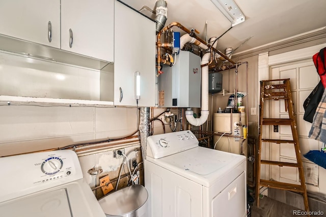 341 High St, Black Hawk, CO 80422 - laundry area featuring cabinet space, water heater, and wood finished floors