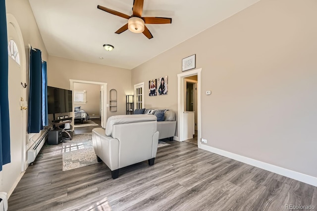 341 High St, Black Hawk, CO 80422 - living room with a baseboard radiator, ceiling fan, wood finished floors, baseboards, and a baseboard heating unit