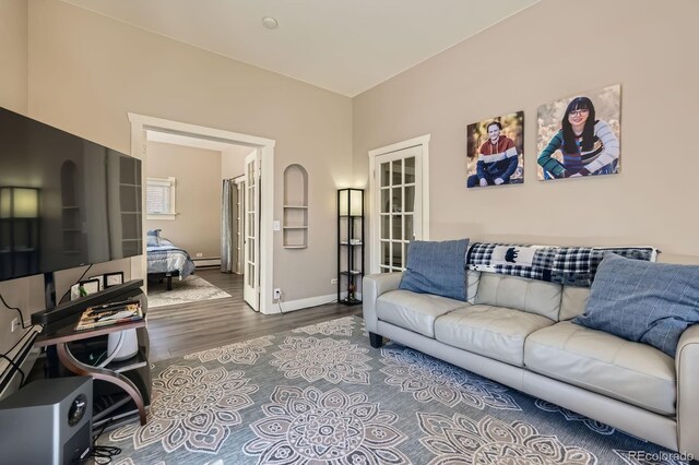 341 High St, Black Hawk, CO 80422 - living room with a baseboard radiator, wood finished floors, and baseboards