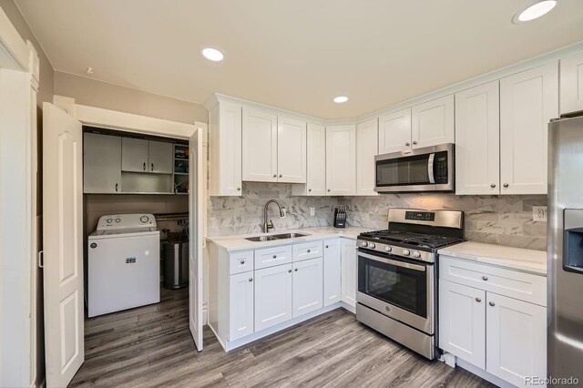 341 High St, Black Hawk, CO 80422 - kitchen featuring appliances with stainless steel finishes, washer / dryer, a sink, light countertops, and recessed lighting