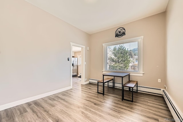 341 High St, Black Hawk, CO 80422 - unfurnished room featuring a baseboard radiator, wood finished floors, and baseboards