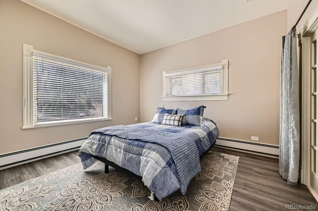 341 High St, Black Hawk, CO 80422 - bedroom featuring baseboard heating, multiple windows, and wood finished floors