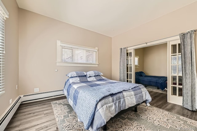 341 High St, Black Hawk, CO 80422 - bedroom with a baseboard radiator and wood finished floors