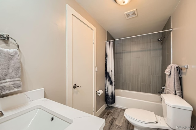 341 High St, Black Hawk, CO 80422 - bathroom with toilet, wood finished floors, shower / bath combination with curtain, and a sink