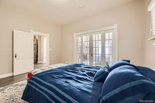 341 High St, Black Hawk, CO 80422 - bedroom featuring french doors, wood finished floors, and baseboards