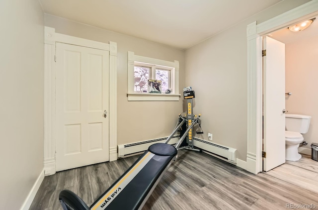 341 High St, Black Hawk, CO 80422 - workout area featuring wood finished floors, baseboards, and a baseboard radiator