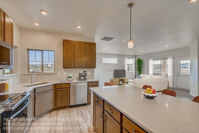 881 W 128th Pl, Westminster, CO 80234 - kitchen featuring dishwasher, electric range, plenty of natural light, light wood-style flooring, and recessed lighting