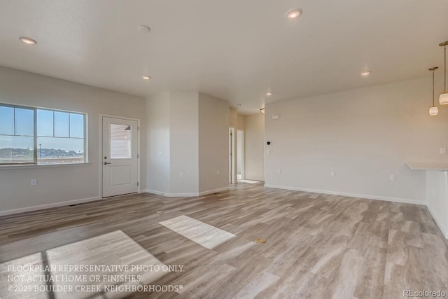 881 W 128th Pl, Westminster, CO 80234 - unfurnished living room featuring light wood-type flooring and recessed lighting