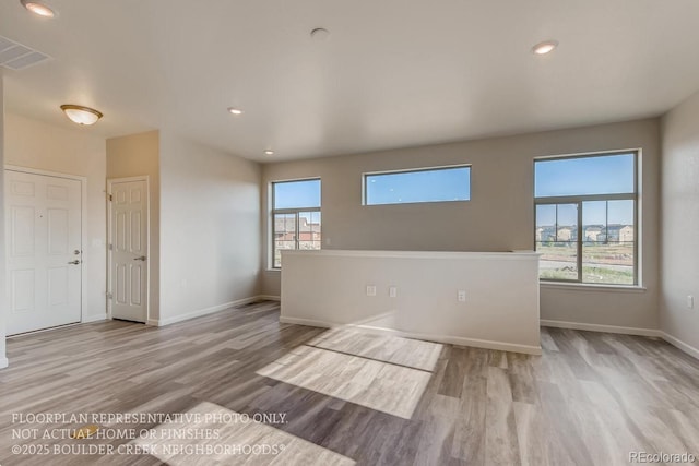 881 W 128th Pl, Westminster, CO 80234 - spare room featuring wood finished floors, plenty of natural light, and recessed lighting