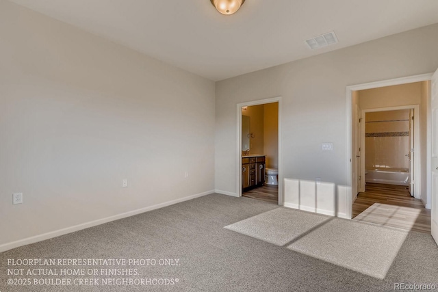881 W 128th Pl, Westminster, CO 80234 - unfurnished bedroom featuring ensuite bathroom and carpet flooring