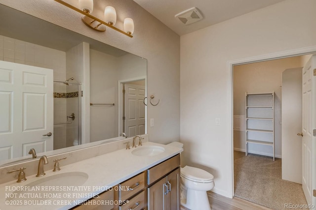 881 W 128th Pl, Westminster, CO 80234 - full bathroom featuring double vanity and tiled shower