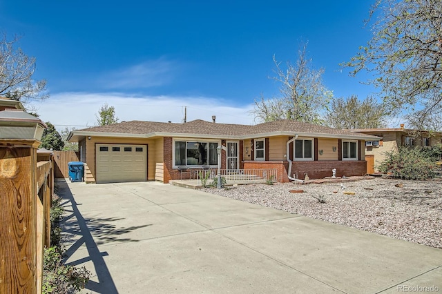 273 S 13th Ave, Brighton, CO 80601 - single story home with fence, an attached garage, concrete driveway, and brick siding