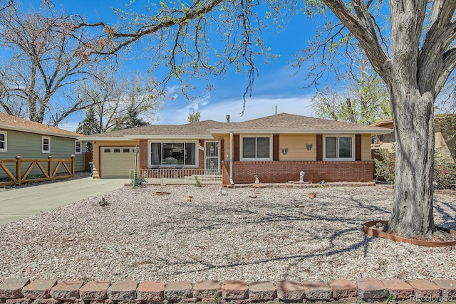 273 S 13th Ave, Brighton, CO 80601 - ranch-style home with brick siding, a garage, fence, and driveway