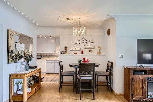 273 S 13th Ave, Brighton, CO 80601 - dining area featuring an inviting chandelier and light wood-style floors