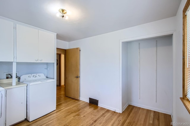 273 S 13th Ave, Brighton, CO 80601 - washroom with cabinet space, light wood finished floors, baseboards, visible vents, and washing machine and dryer