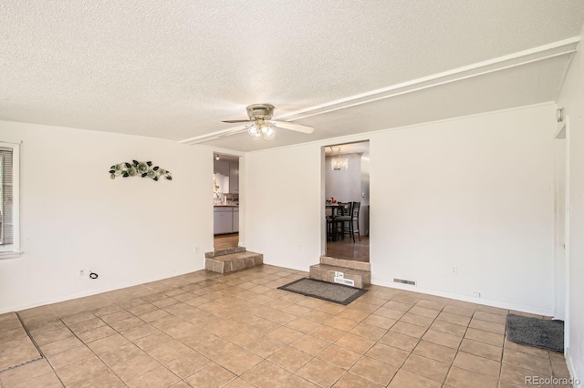 273 S 13th Ave, Brighton, CO 80601 - spare room with light tile patterned floors, a textured ceiling, visible vents, and ceiling fan
