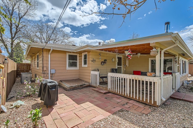 273 S 13th Ave, Brighton, CO 80601 - rear view of property featuring a patio, ceiling fan, and a fenced backyard