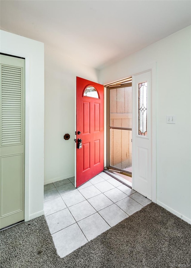 foyer entrance featuring light tile patterned floors