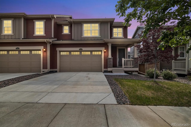 17848 Gallup St, Broomfield, CO 80023 - multi unit property featuring board and batten siding, an attached garage, driveway, and covered porch