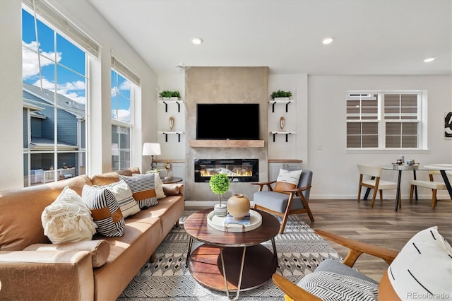 17848 Gallup St, Broomfield, CO 80023 - living area featuring wood finished floors, a fireplace, and recessed lighting