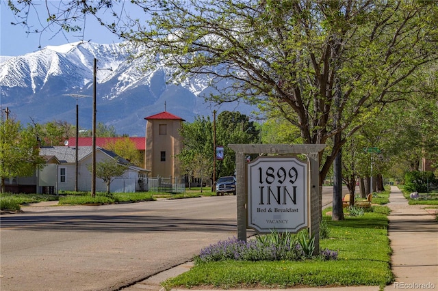 community sign featuring a mountain view