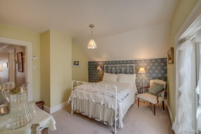 carpeted bedroom featuring lofted ceiling