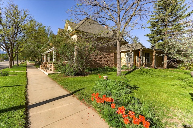 view of home's exterior featuring a lawn