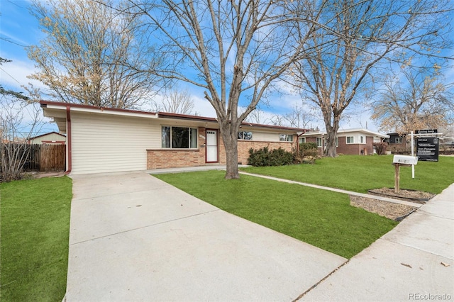 ranch-style home with a front lawn