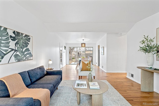 living room with light hardwood / wood-style flooring