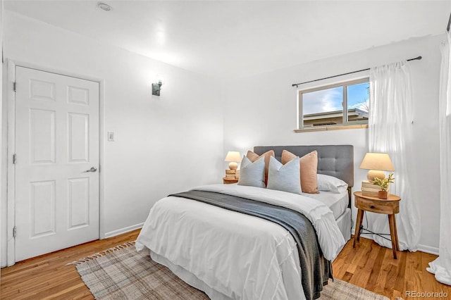 bedroom with light wood-type flooring