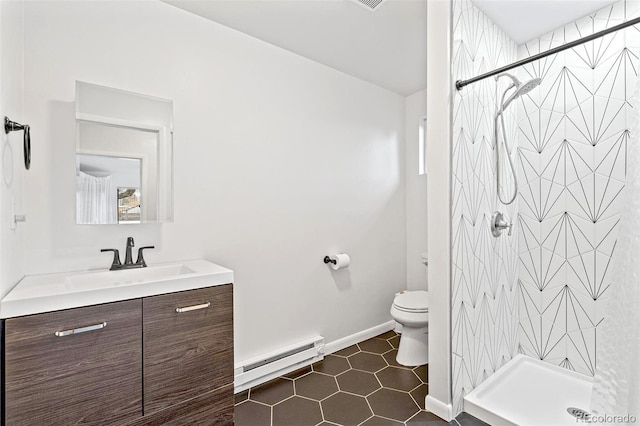 bathroom with tile patterned floors, walk in shower, vanity, baseboard heating, and toilet