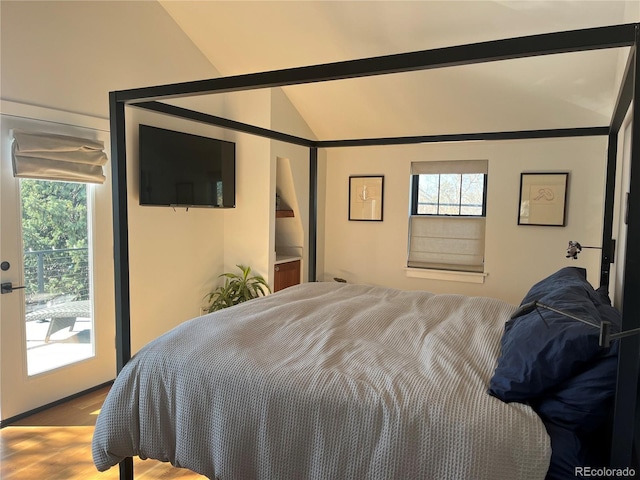 1690 Spruce St, Denver, CO 80220 - bedroom with vaulted ceiling, wood finished floors, and access to outside
