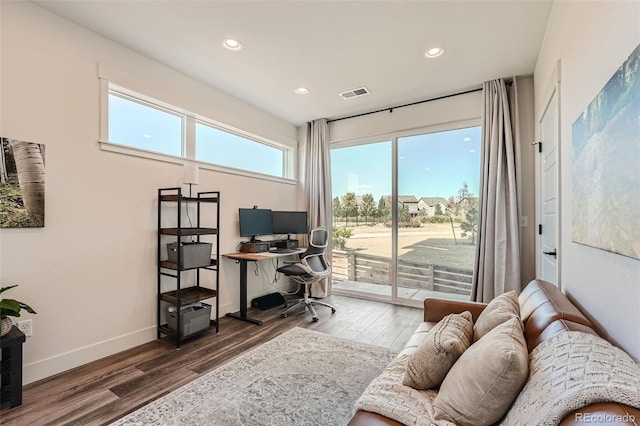 office with visible vents, recessed lighting, wood finished floors, and baseboards