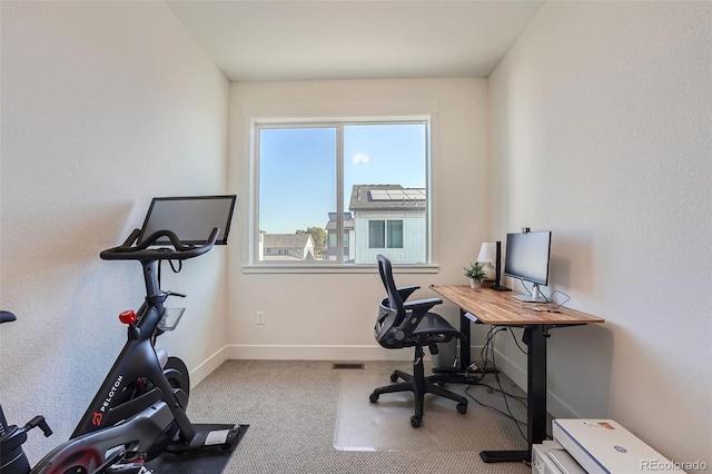 office featuring visible vents, baseboards, and carpet