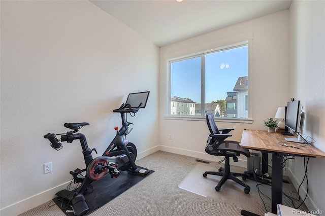 office space with carpet, baseboards, and visible vents